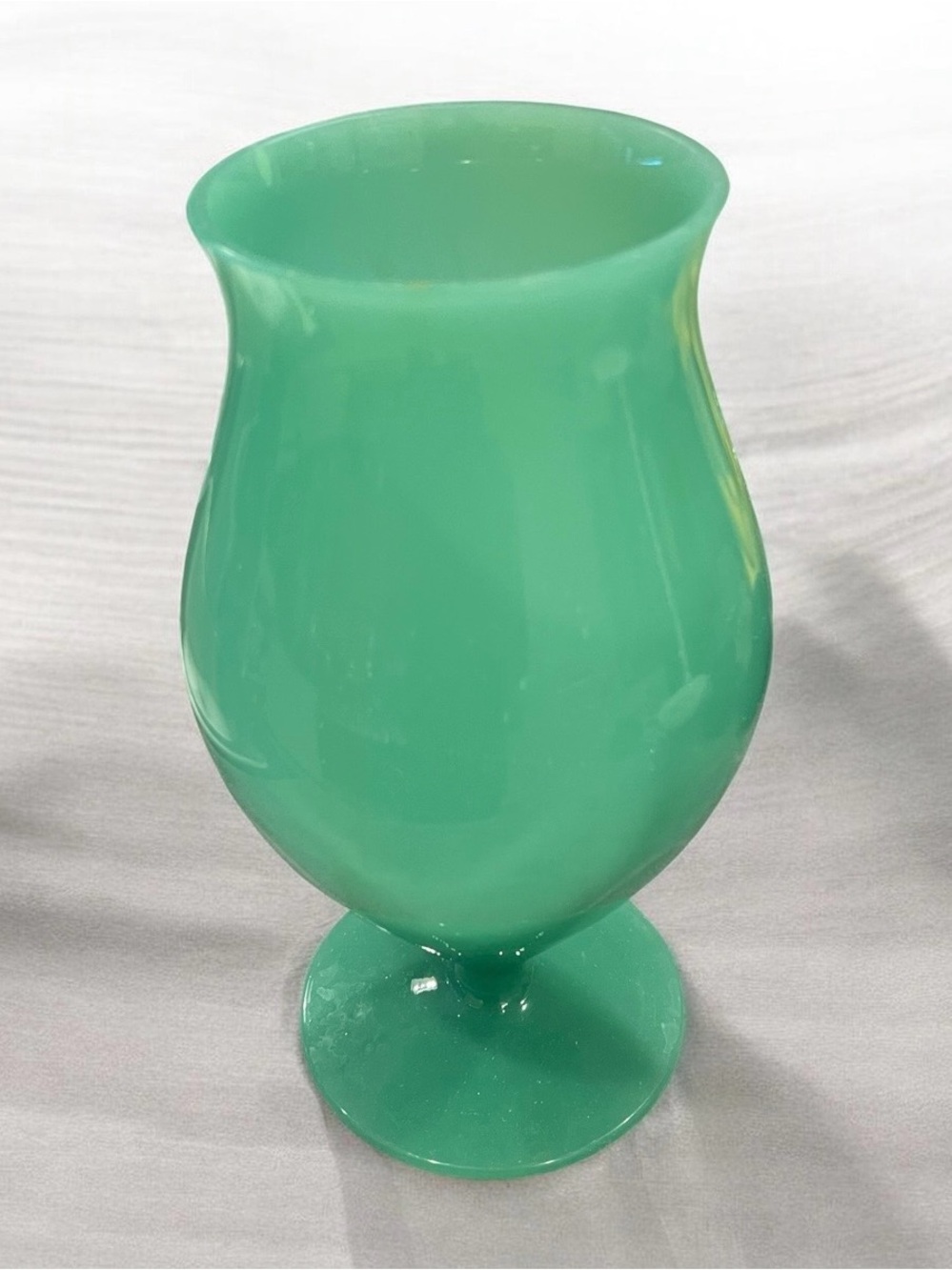 elegant mid-20th century Murano green glass vase with a pedestal base.
